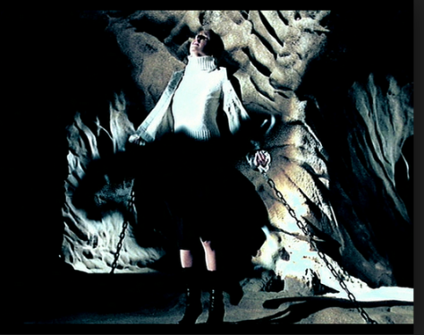 Buffy, trapped by the Shadow Men, is shown as vulnerable and being engulfed by their penetrative force